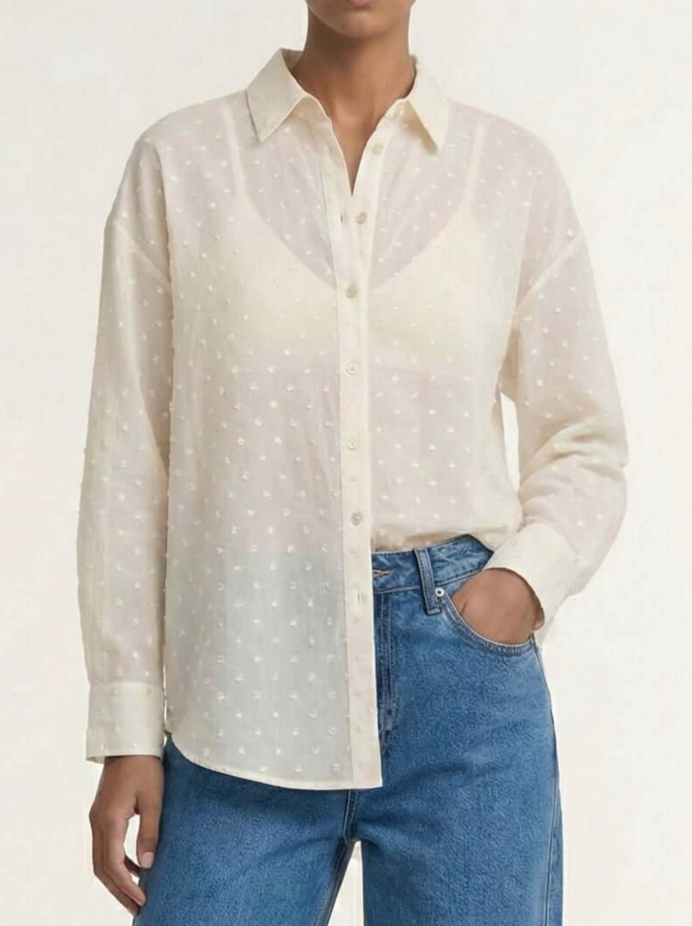 Image of a model wearing Tops. Product name - Staple The Label Etoile Oversized Shirt in Cream colour by brand - Staple