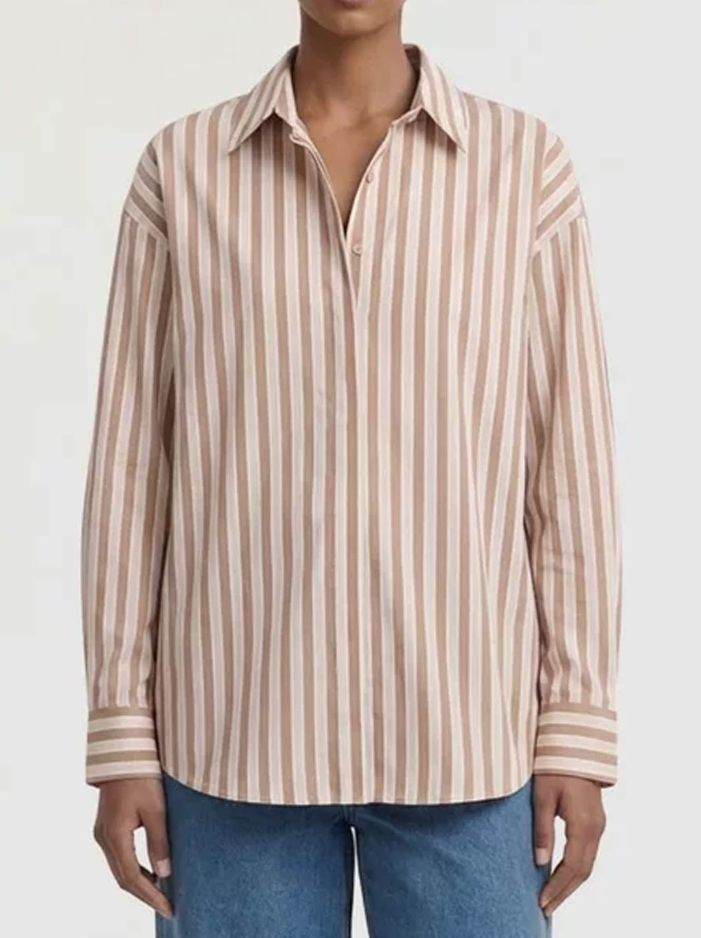 Image of a model wearing Tops. Product name - Staple The Label Solace Oversized Shirt in Tan/White colour by brand - Staple