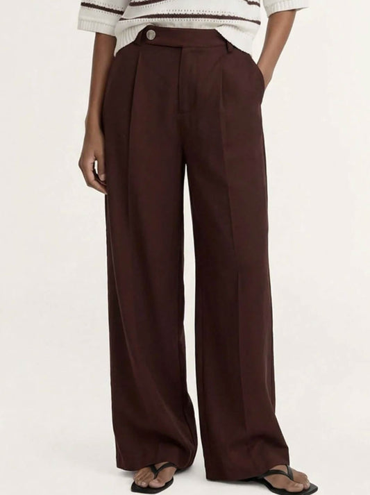 Image of a model wearing Pants. Product name - Staple The Label Rhodes Tailor Pant in Chocolate colour by brand - Staple