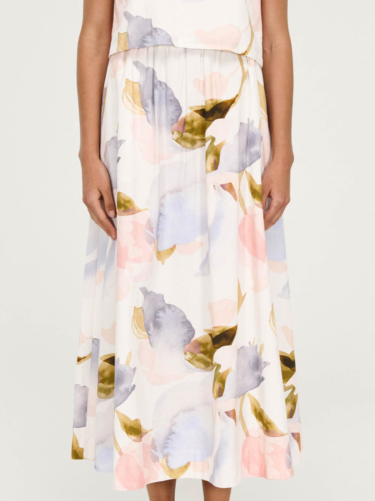 Image of a model wearing Skirts. Product name - Staple The Label Valea Midi Skirt in Watercolour colour by brand - Staple