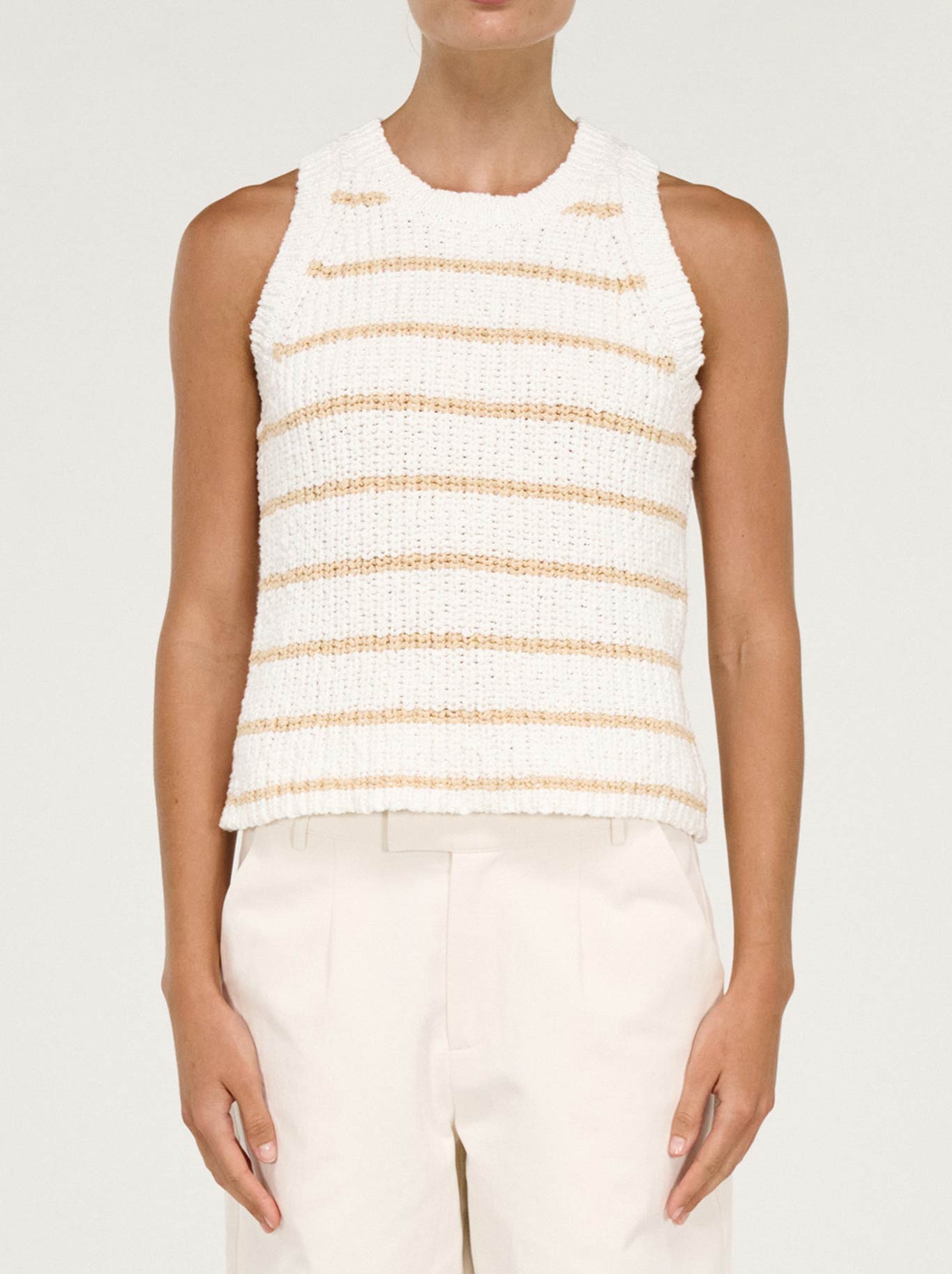 Image of a model wearing Outerwear. Product name - Staple The Label Cove Stripe Knit Tank in White/Beige colour by brand - Staple