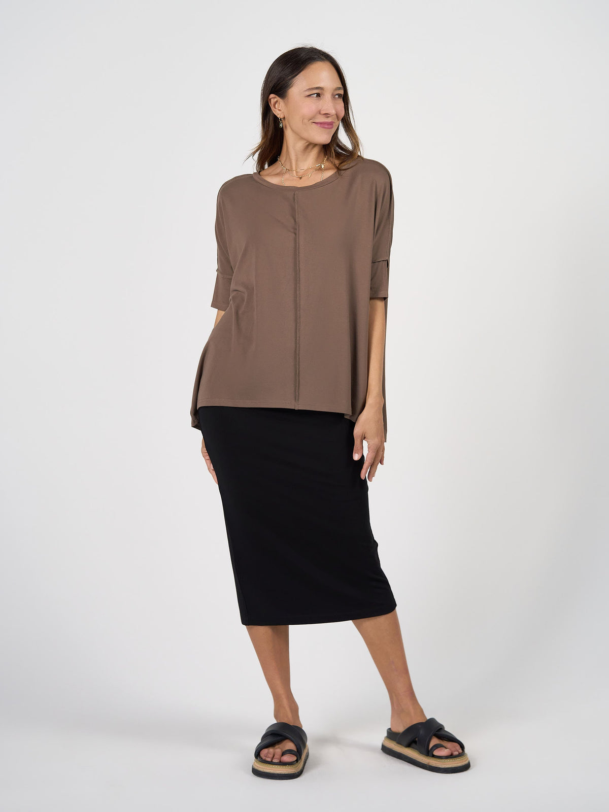Image of a model wearing Tops. Product name - Stella Oversized Bamboo Slouch T-Shirt Chocolate in Chocolate colour by brand - Lou Lou