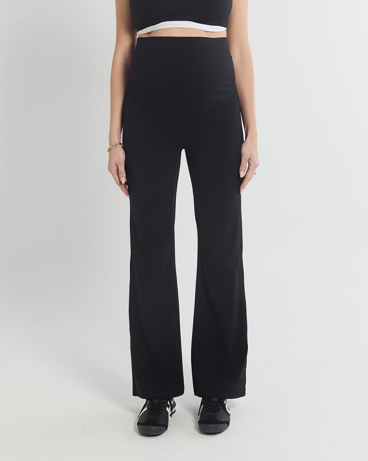 Image of a model wearing Pants. Product name - Straight Flare No Line Leggings in colour by brand - Soon Maternity