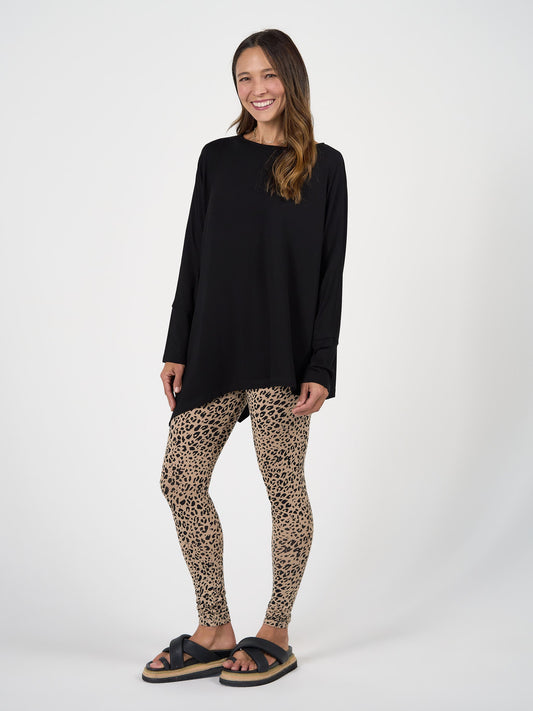 Image of a model wearing Pants. Product name - Luxe Bamboo Full-Length Legging Brown Leopard in Brown Leopard colour by brand - Lou Lou