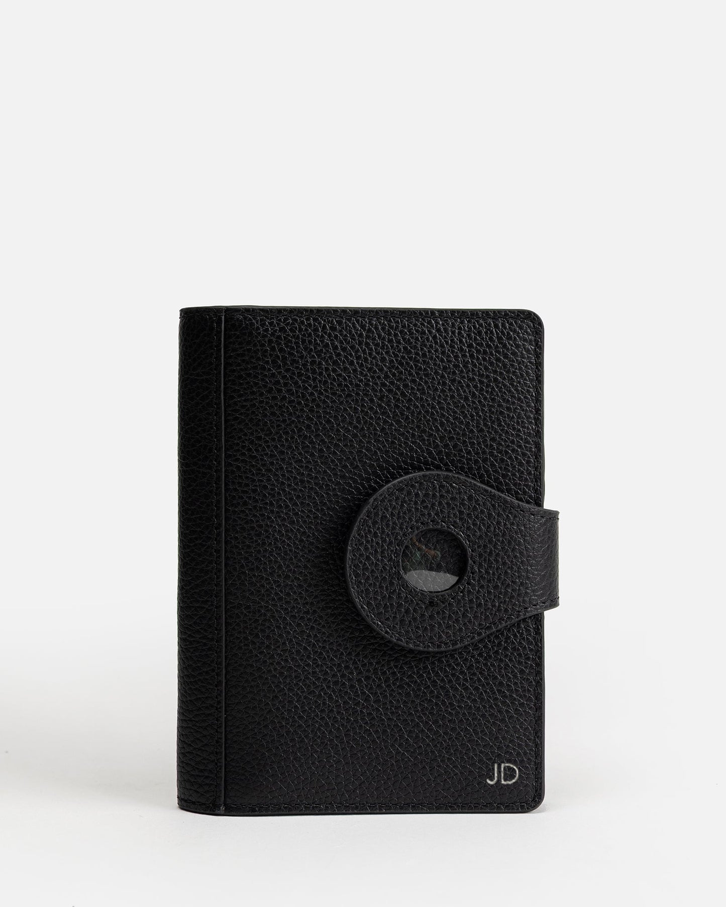 Image of Badge & Pass Holders. Productname: Jude Airtag Passport Holder Black in Black colour by brand - The Daily Edited