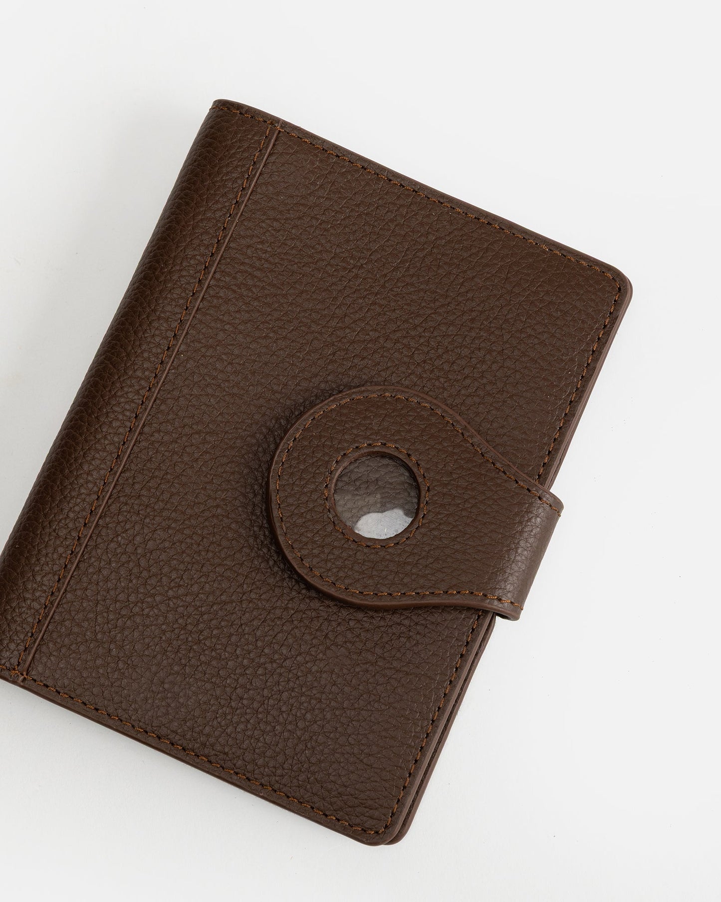 Image of Badge & Pass Holders. Productname: The Daily Edited Jude Airtag Passport Holder Chestnut in Chestnut colour by brand - The Daily Edited
