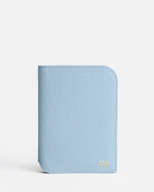 Image of Badge & Pass Holders. Product name - Olivia Passport Holder Baby Blue in Blue colour by brand - The Daily Edited