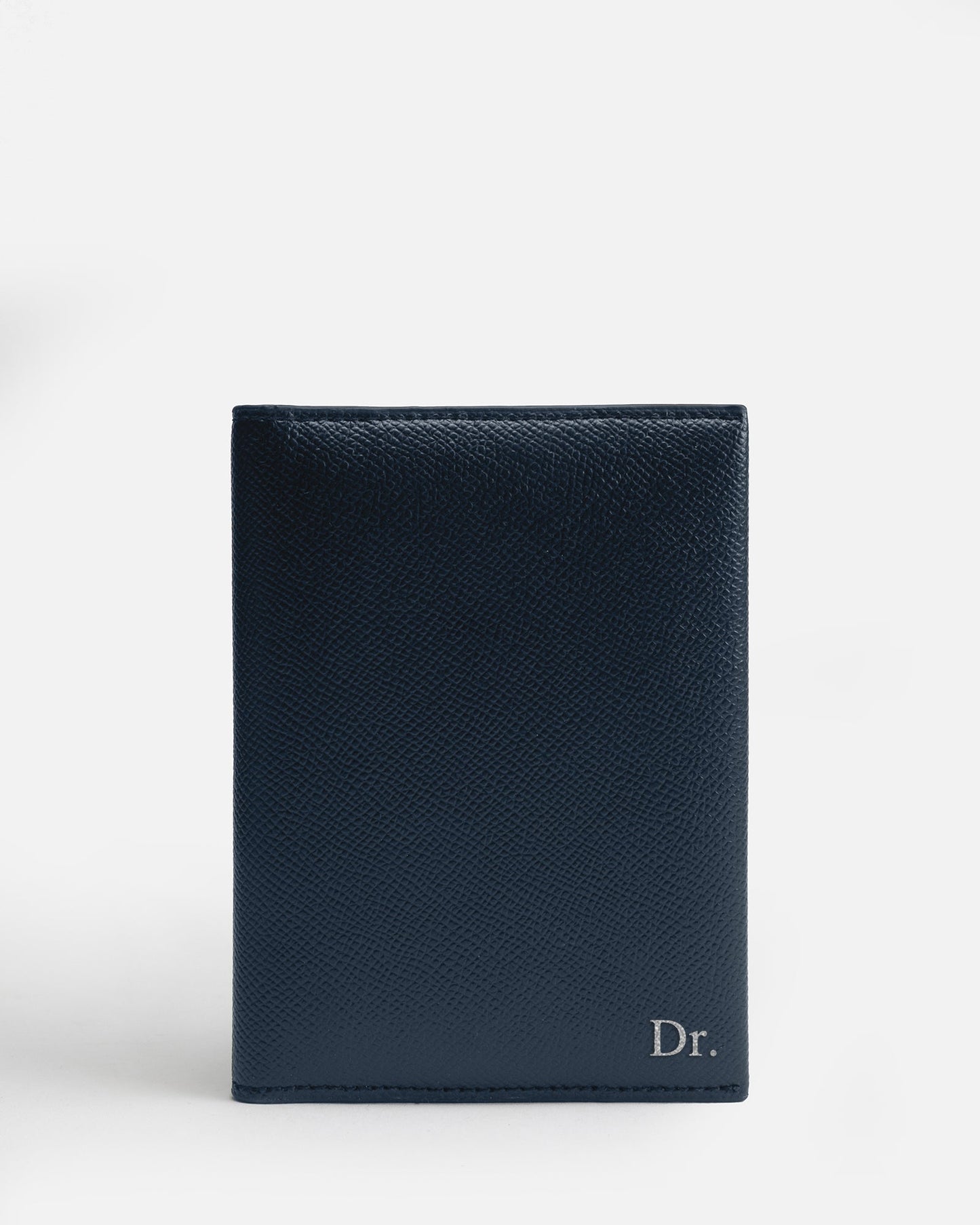 Image of Badge & Pass Holders. Product name - Essentials Passport Sleeve Navy in Navy colour by brand - The Daily Edited