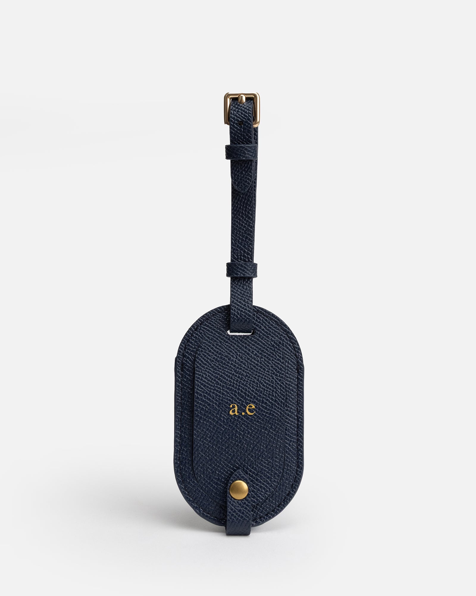 Image of Badge & Pass Holders. Product name - Essentials Round Luggage Tag Navy in Navy colour by brand - The Daily Edited