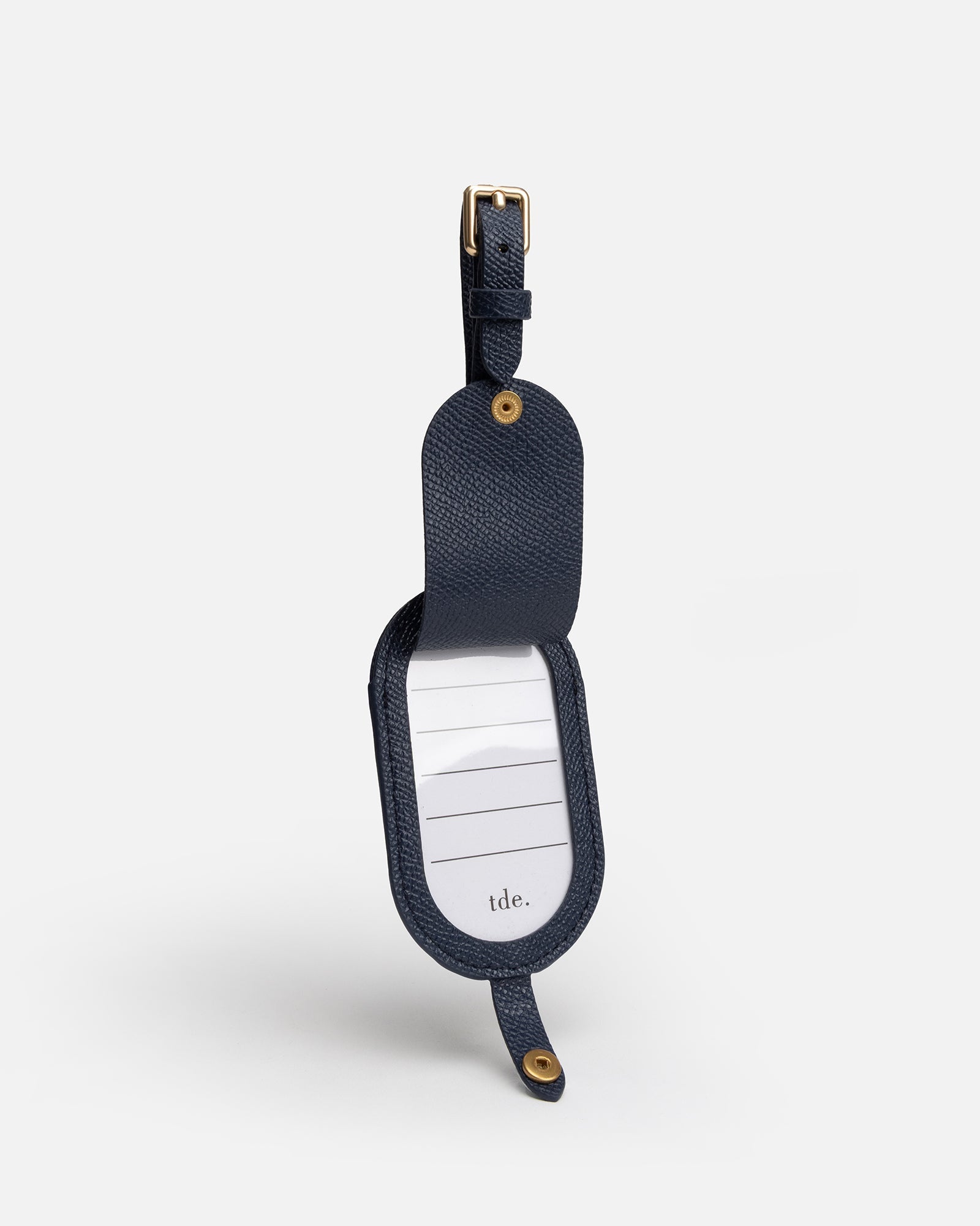 Image of Badge & Pass Holders. Product name - Essentials Round Luggage Tag Navy in Navy colour by brand - The Daily Edited