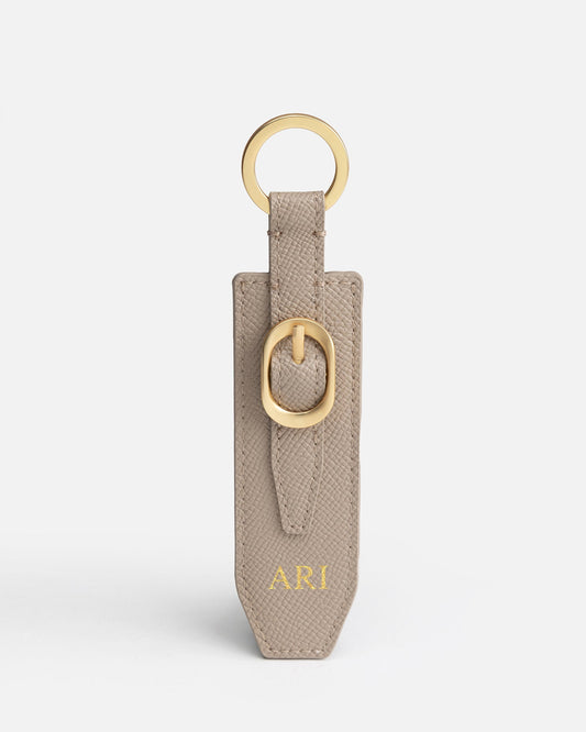 Image of Keychains. Product name - Aria Keyring Sepia in Sepia colour by brand - The Daily Edited