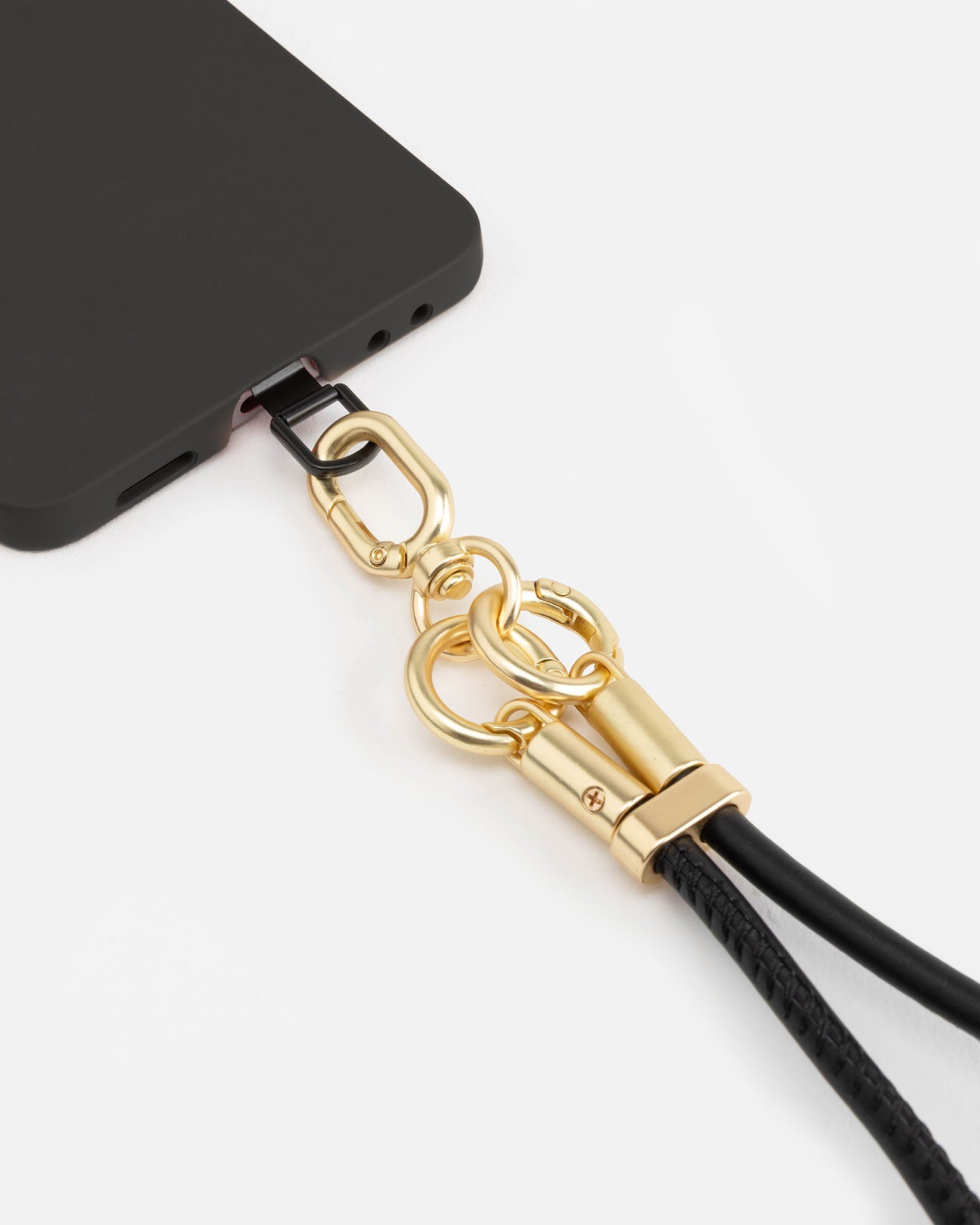 Image of Accessories. Product name - Phone Wristlet Black in Black colour by brand - The Daily Edited