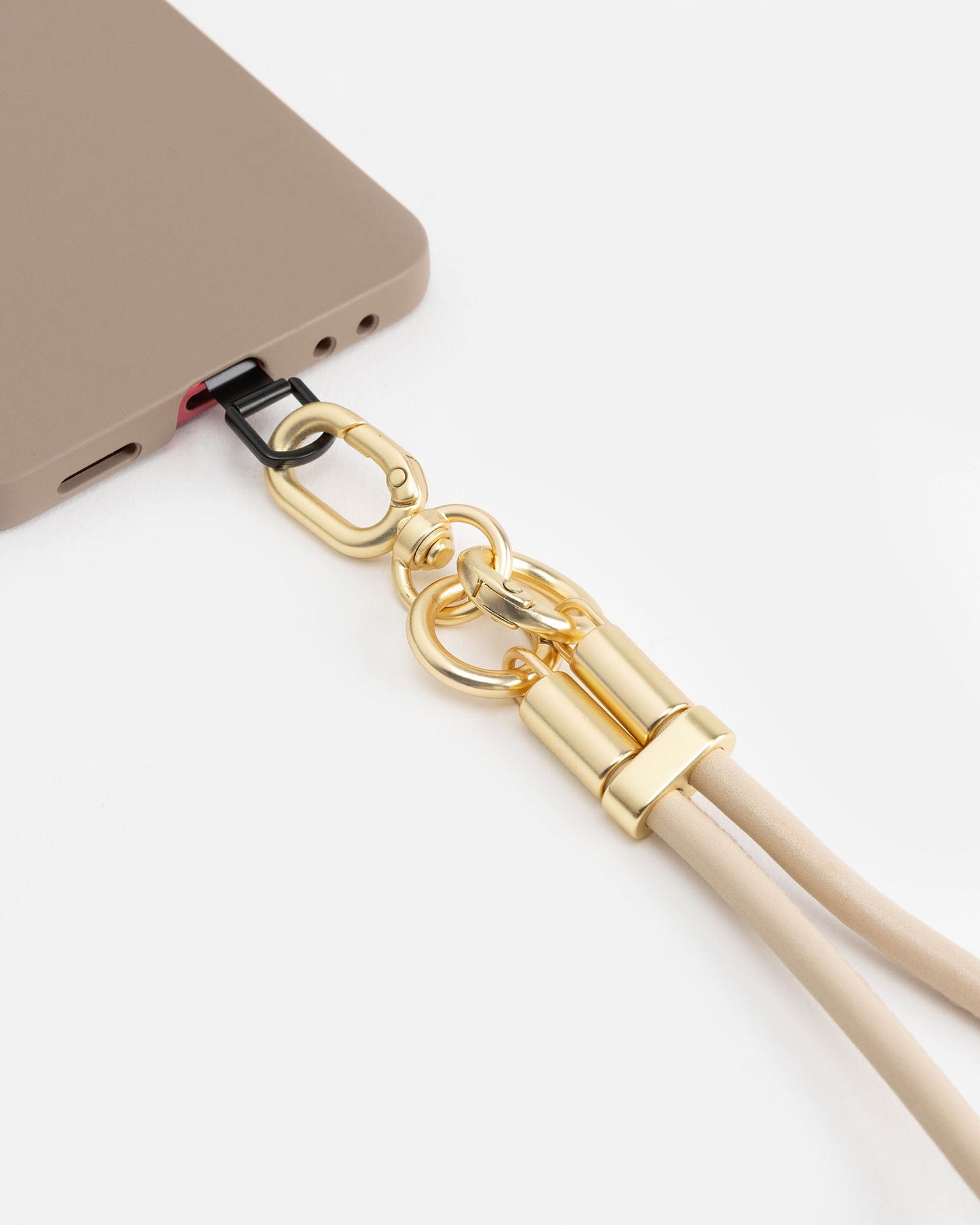 Image of Accessories. Product name - Phone Wristlet Cream in Cream colour by brand - The Daily Edited