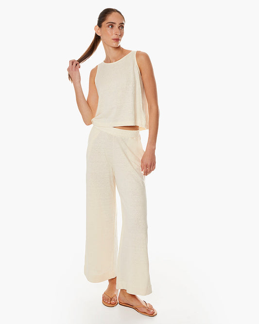 Image of a model wearing Pants. Productname: Brise d'été Pant Ivory in Ivory colour by brand - TKEES