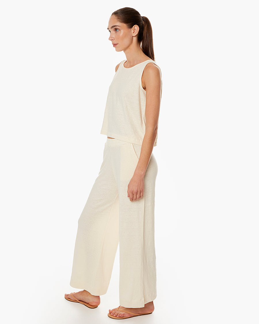 Image of a model wearing Tops. Productname: Brise d'été Tank Ivory in Ivory colour by brand - TKEES