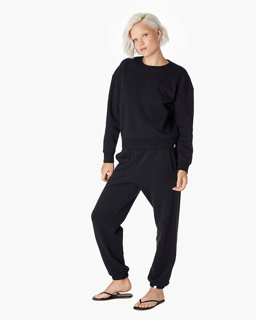 Image of a model wearing Tops. Productname: Air Whipped Crew Black in Black colour by brand - TKEES