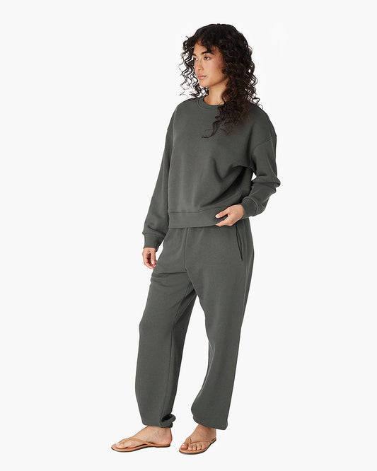 Image of a model wearing Tops. Productname: Air Whipped Crew Forest in Forest colour by brand - TKEES
