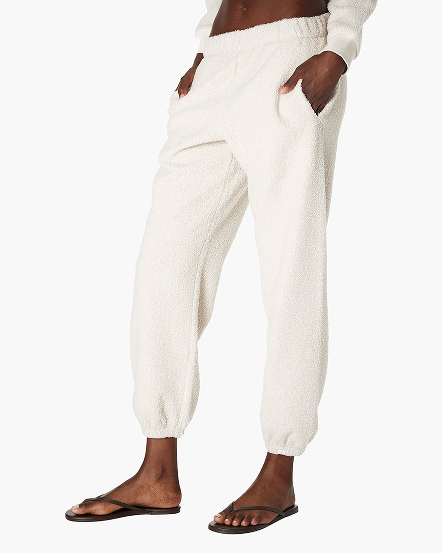 Image of a model wearing Pants. Productname: Cotton Candy Sweatpant in Bone colour by brand - TKEES