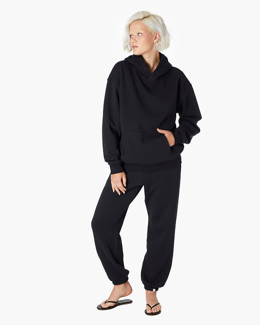 Image of a model wearing Outerwear. Productname: Air Whipped Hoodie Black in Black colour by brand - TKEES