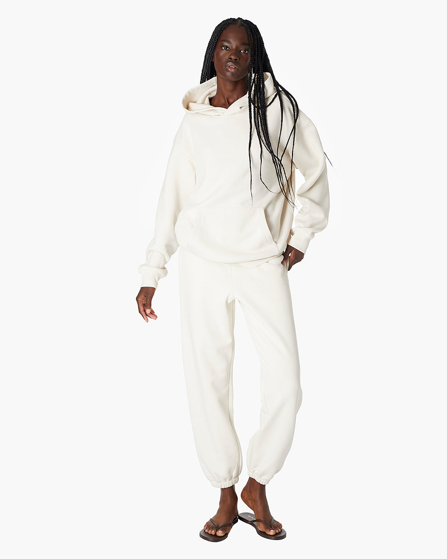 Image of a model wearing Outerwear. Productname: Air Whipped Hoodie Bone in Bone colour by brand - TKEES
