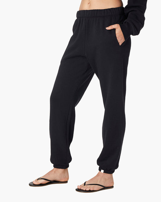 Image of a model wearing Pants. Productname: Air Whipped Sweatpant Black in Black colour by brand - TKEES