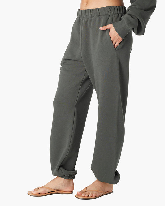 Image of a model wearing Pants. Productname: Air Whipped Sweatpant Forest in Forest colour by brand - TKEES