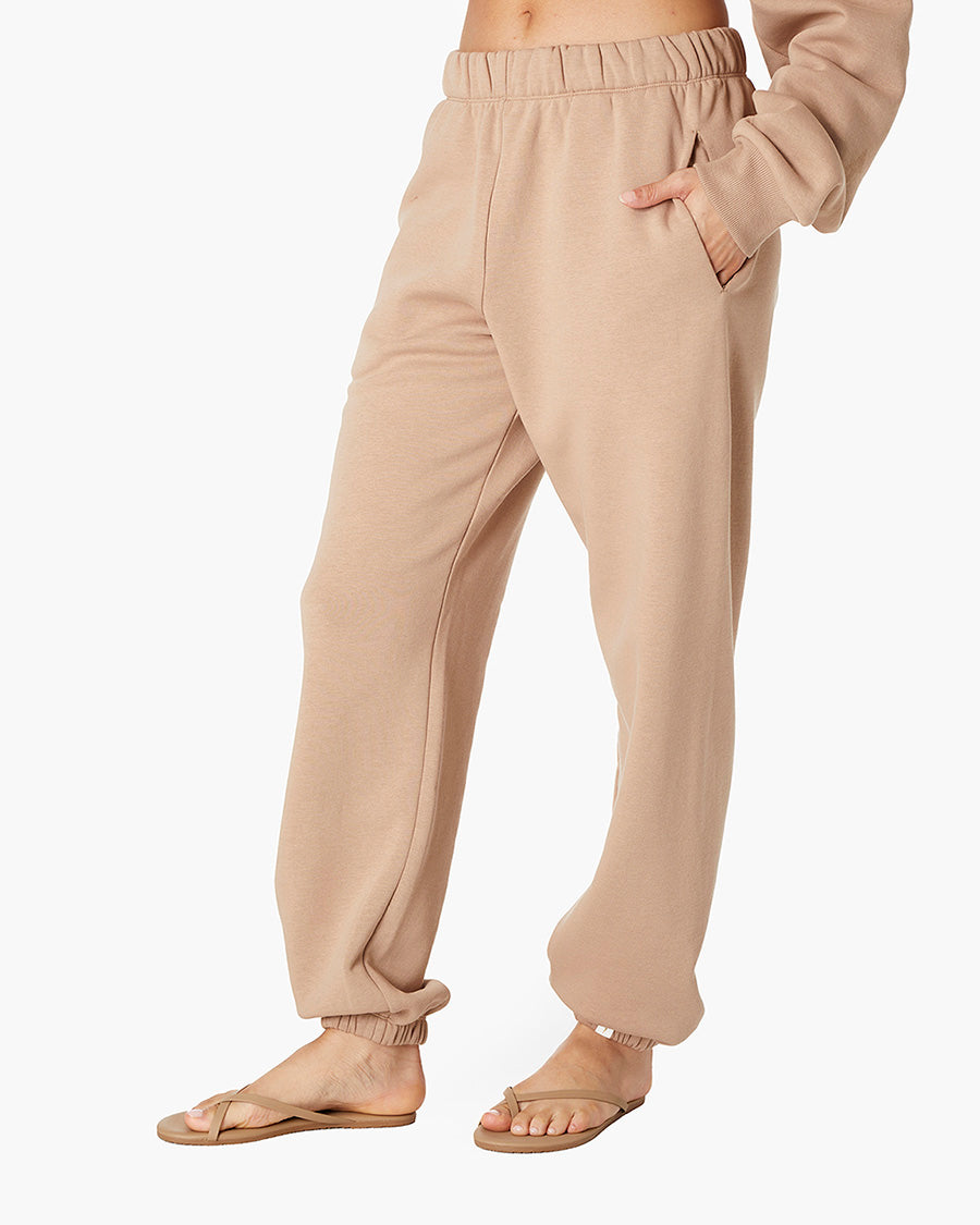 Image of a model wearing Pants. Productname: Air Whipped Sweatpant Camel in Camel colour by brand - TKEES