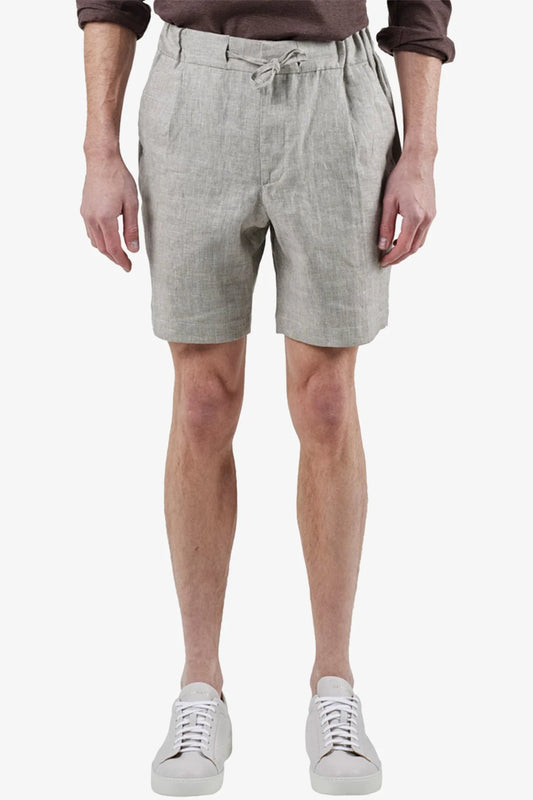 Image of a model wearing Shorts. Product name - Tagliata Oatmeal Shorts in Oat colour by brand - Anthony Squires