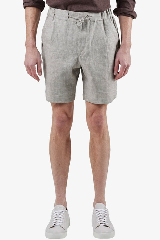 Image of a model wearing Shorts. Product name - Tagliata Oatmeal Shorts in Oat colour by brand - Anthony Squires