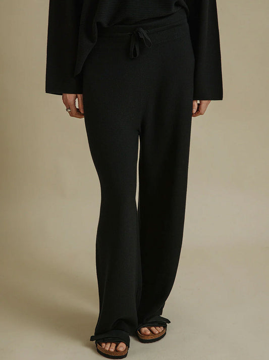 Image of a model wearing Pants. Productname: TALAMAYA GRACE PANT in Black colour by brand - Talamaya