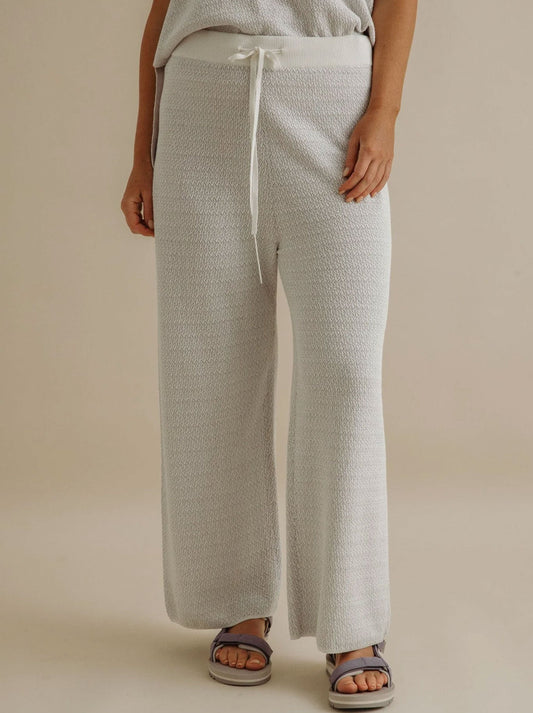 Image of a model wearing Pants. Productname: Talamaya Crepe Knitted Pant in Milk Silver Haze colour by brand - Talamaya
