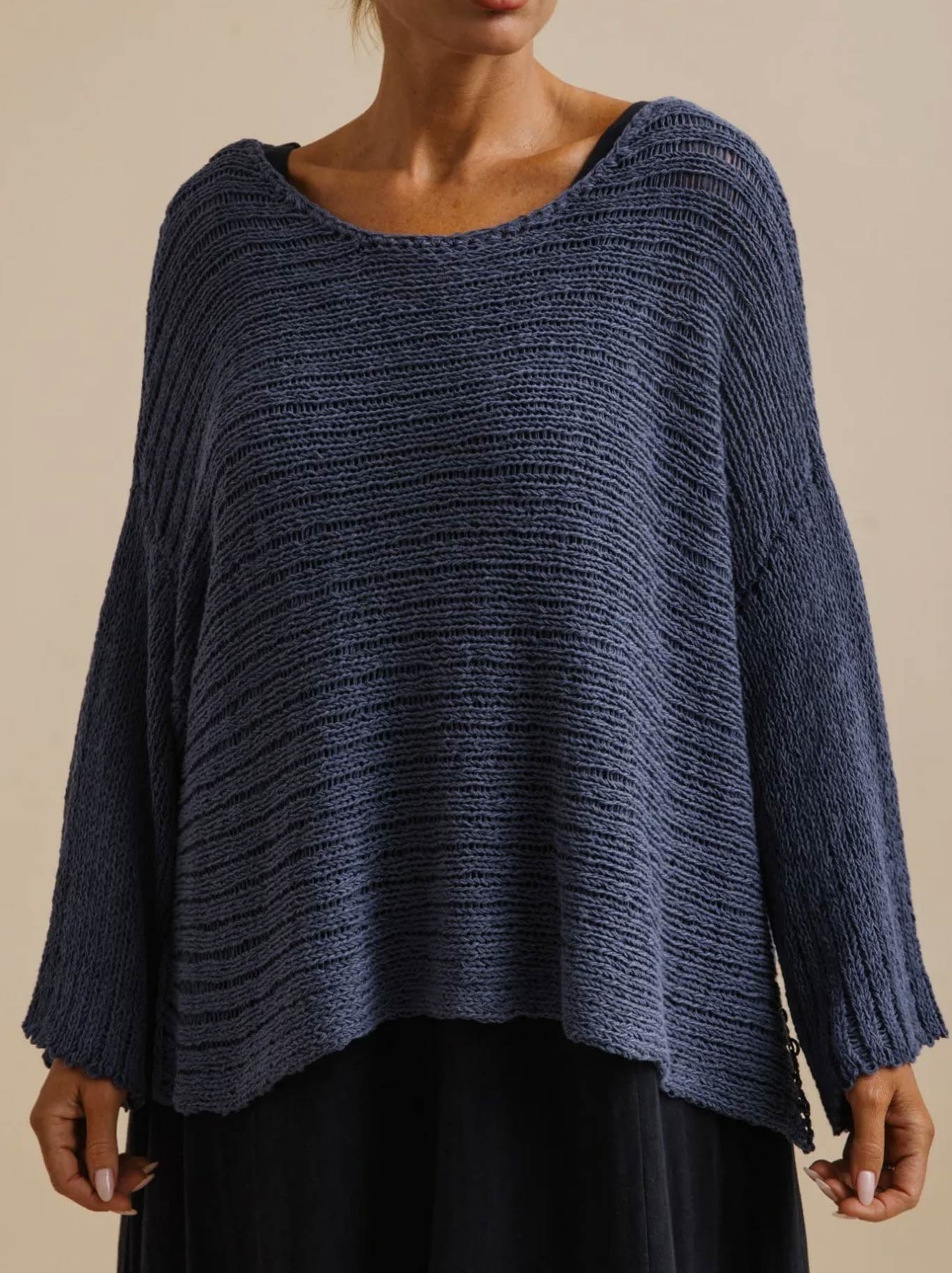 Image of a model wearing Outerwear. Product name - Talamaya Coast To Coast Pullover in Indigo colour by brand - Talamaya