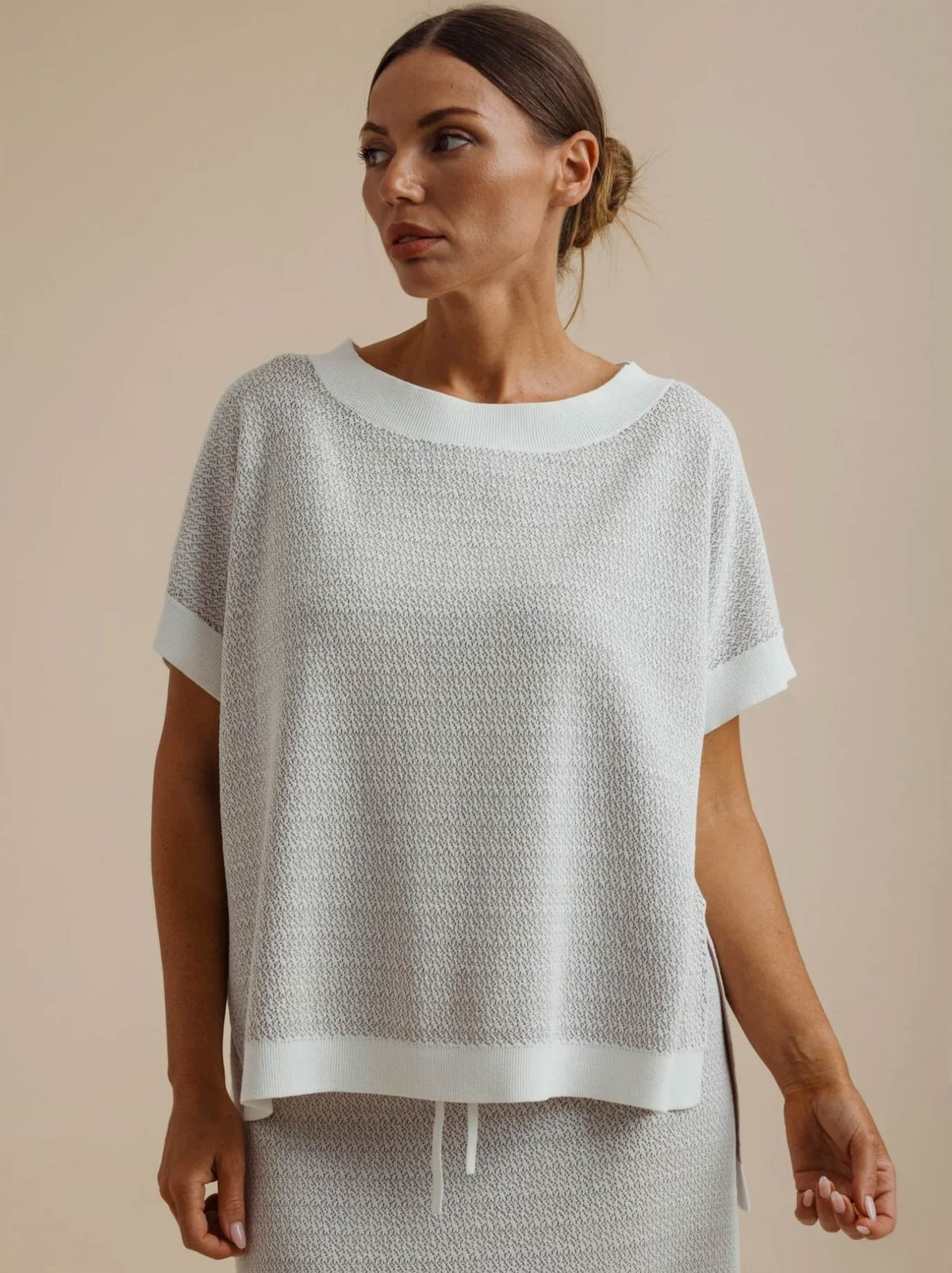 Image of a model wearing Outerwear. Product name - TALAMAYA CREPE KNITTED TEE in Salt/Granite colour by brand - Talamaya