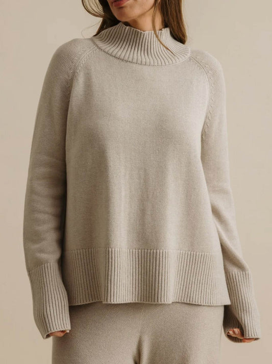 Image of a model wearing Outerwear. Productname: Talamaya Harmony Mock Neck Pullover in Wheat colour by brand - Talamaya