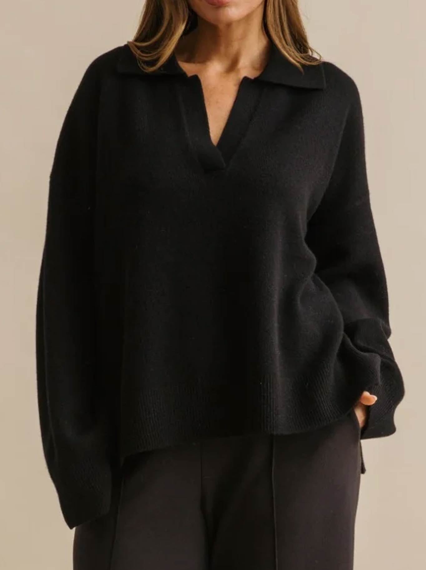 Image of a model wearing Outerwear. Product name - Talamaya Hope Merino Pullover in Jet colour by brand - Talamaya