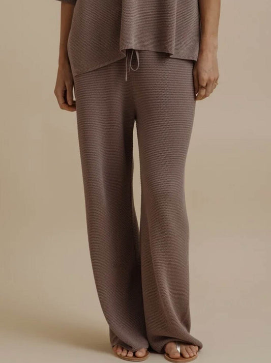 Image of a model wearing Pants. Product name - TALAMAYA LATTICE CRUISE PANT in Husk colour by brand - Talamaya