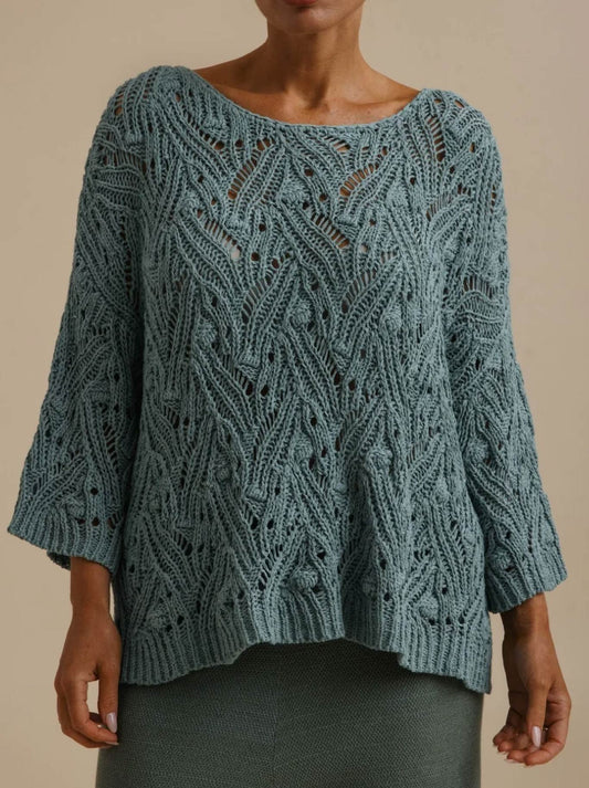 Image of a model wearing Outerwear. Product name - Talamaya Prism Pullover in Sage colour by brand - Talamaya