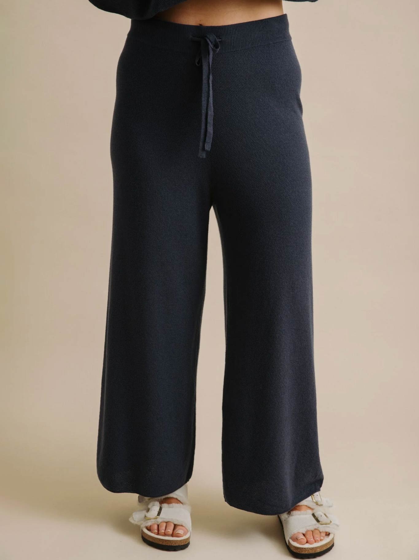 Image of a model wearing Pants. Product name - TALAMAYA WINTER RETREAT PANT in Lake colour by brand - Talamaya