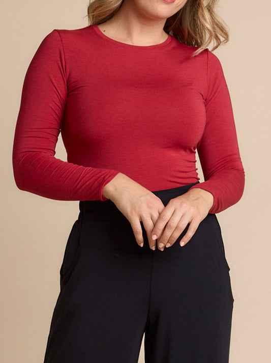 Image of a model wearing Tops. Productname: TANI MARLE LONG SLEEVE HIGH NECK TOP in Red Berry colour by brand - Tani