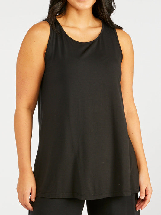 Image of a model wearing Tops. Productname: TANI GRACE SWING TANK in Black colour by brand - Tani