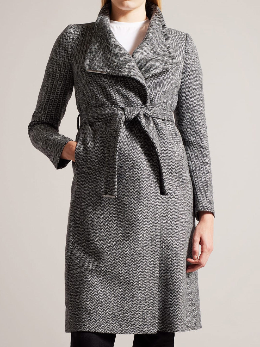 Image of a model wearing Outerwear. Productname: TED BAKER ROSEANE HERRINGBONE WOOL COAT in Black colour by brand - Ted Baker