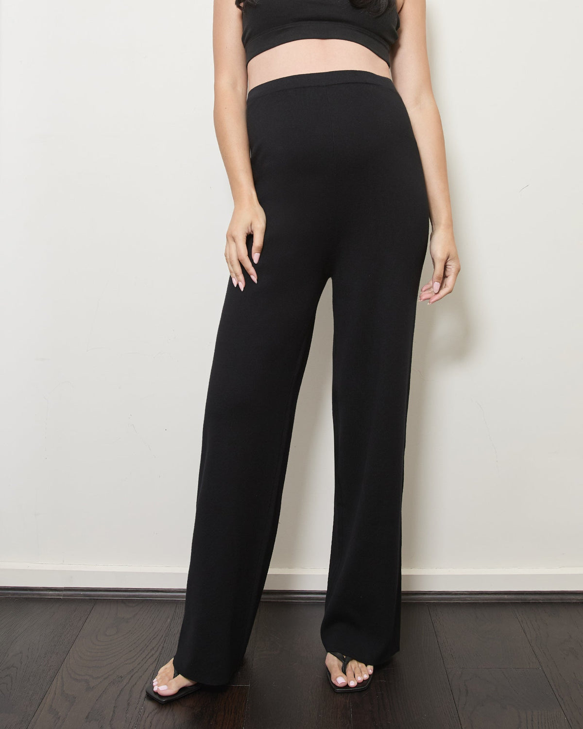 Image of a model wearing Pants. Product name - The Knit Straight Pants in colour by brand - Soon Maternity