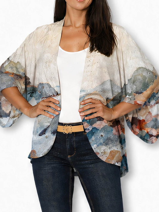 Image of a model wearing Tops. Product name - The Artists Label Coastal Mist Silk Kimono in Print colour by brand - The Artist Label