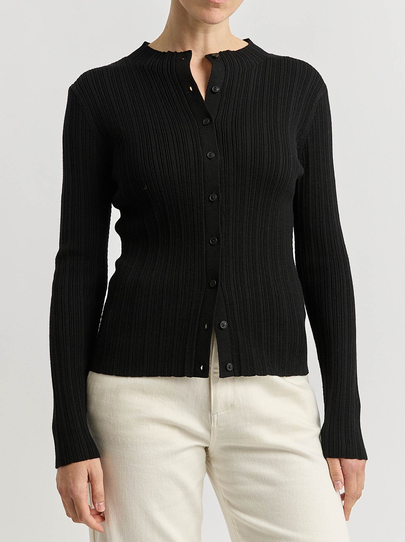 Image of a model wearing Outerwear. Productname: TOORALLIE VARIEGATED RIB CARDI in Black colour by brand - Toorallie