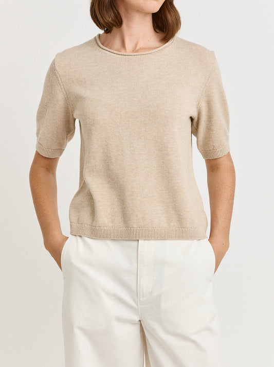 Image of a model wearing Outerwear. Product name - Toorallie Short Sleeve Knit in Jute colour by brand - Toorallie