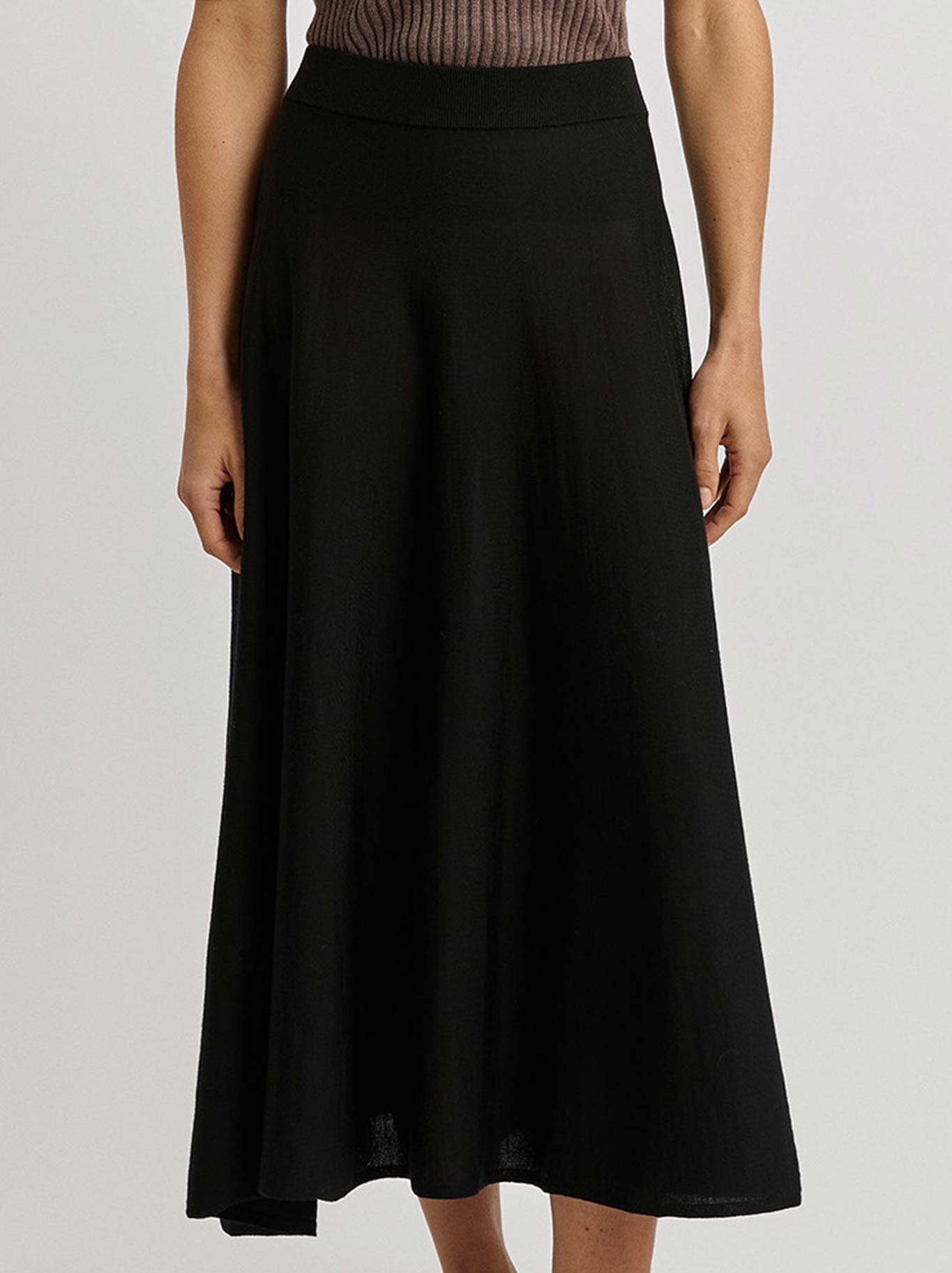 Image of a model wearing Skirts. Productname: TOORALLIE A-LINE MIDI SKIRT in Black colour by brand - Toorallie