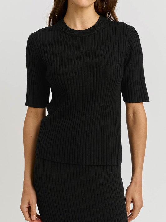 Image of a model wearing Tops. Product name - Toorallie Rib Knit Top in Black colour by brand - Toorallie