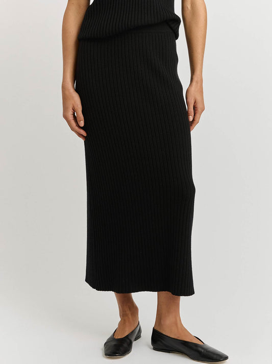 Image of a model wearing Skirts. Productname: TOORALLIE RIB KNIT SKIRT in Black colour by brand - Toorallie