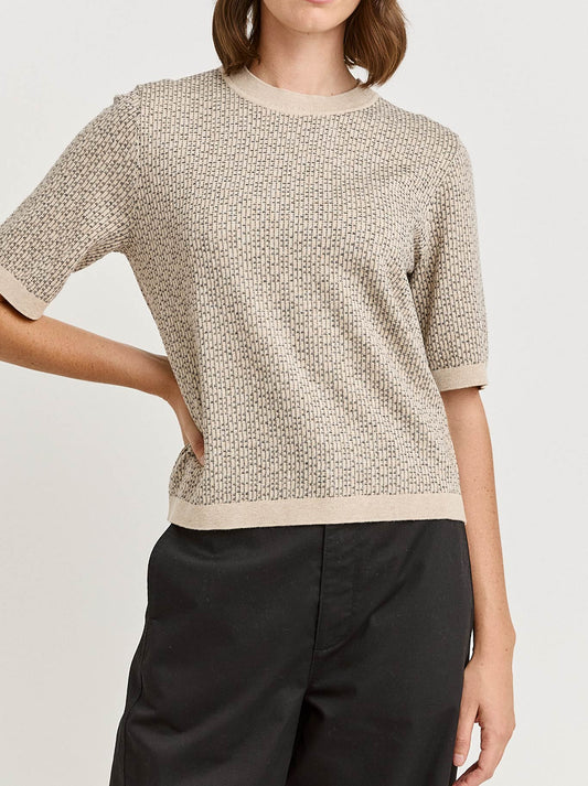 Image of a model wearing Outerwear. Product name - Toorallie Matrix Knit Top in Jute colour by brand - Toorallie