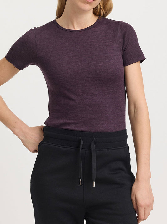 Image of a model wearing Tops. Productname: TOORALLIE MERINO SHORT SLEEVE TEE in Black colour by brand - Toorallie